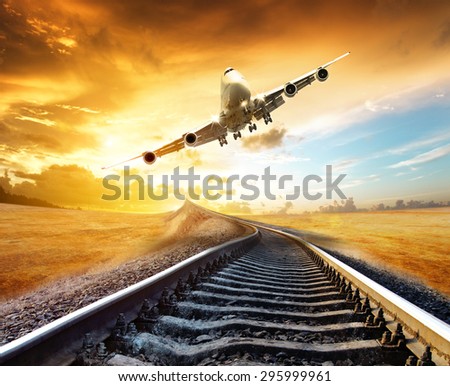 airplane landing on the tracks of the train