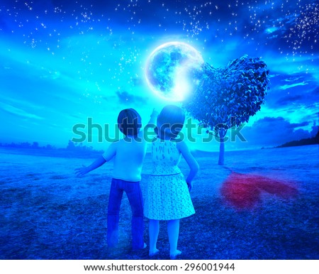 children in the night of full moon with heart tree