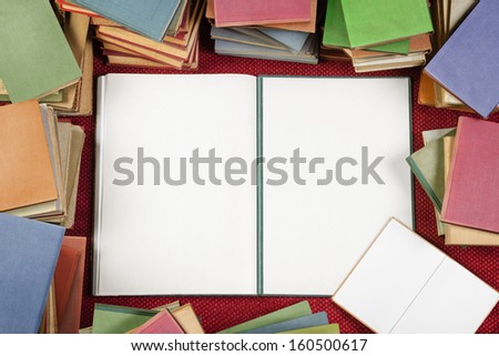 Colorful books background with blank book opened