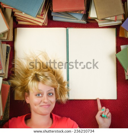 Cheerful female student showing the blank page of the book - Square composition