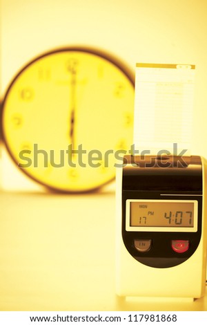 A check-in timer and a clock in the back