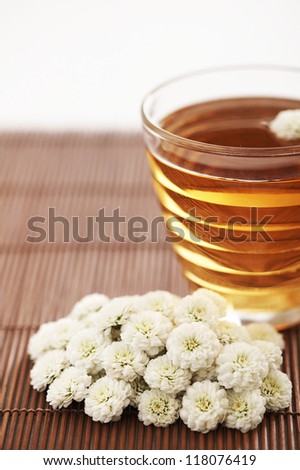 A bunch of flowers and a cup of tea