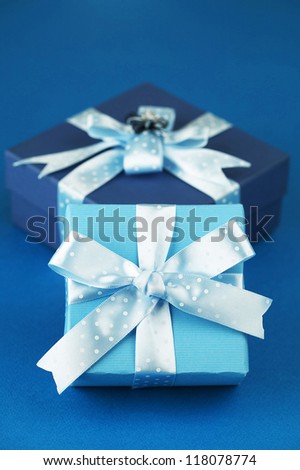 Dark blue and sky blue boxes in a row in blue background