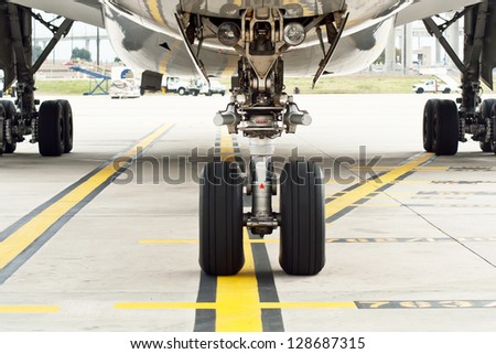 Commercial airplane wheels shot from on the tarmac.