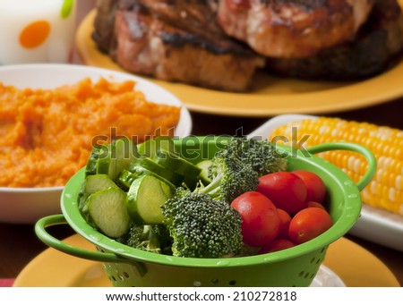 Garden fresh vegetables served with corn, pork chops and mashed sweet potatoes.