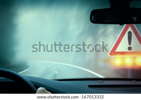 bad weather driving - foggy hazy country road