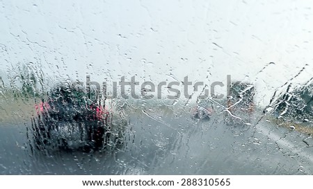 Bad Weather Driving - poor view caused by heavy rain and  spray water