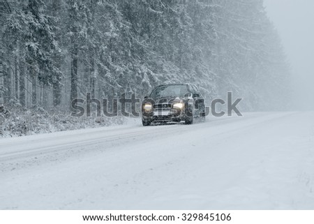 Winter driving - country road in winter - risk of snow and ice