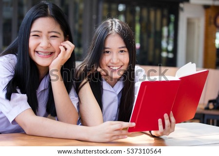 two asia thai high school student uniform Best friends beautiful girl reading book