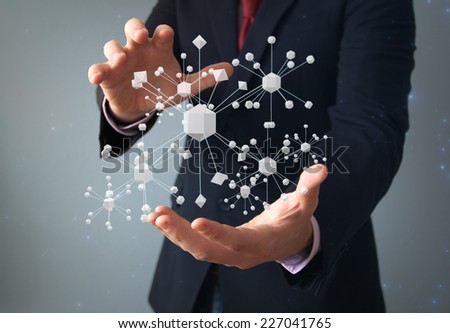 physics or connection concept: businessman with molecular structure on hands