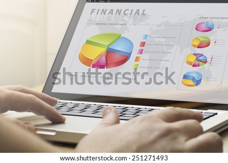 telecommuting work concept: man using laptop with financial software on the screen