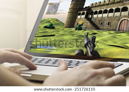 gaming concept: man using a laptop to play war game