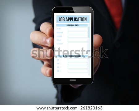job search concept: businessman hand holding a touch phone with online job application on the screen
