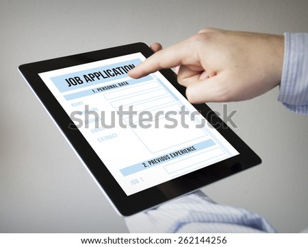 new technologies concept: hands with touchscreen tablet with job application form