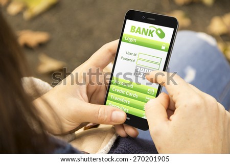 banking security concept: young woman with online banking application phone at the park
