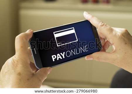 pay online concept: mature woman hands with a 3d generated smartphone with pay online on screen