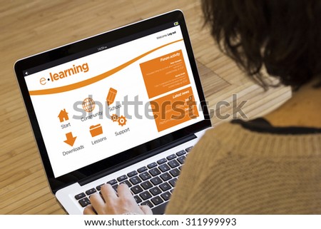 online education and training concept: e-learning platform on a laptop screen. Screen graphics are made up.