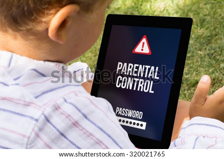 child with parental control at a tablet