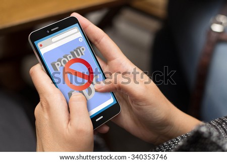 protection concept: girl using a digital generated phone with ads blocker on the screen. All screen graphics are made up.