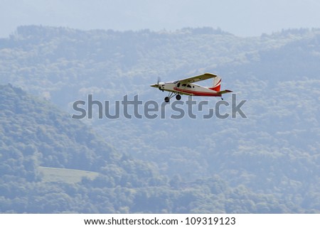 Radio controlled model airplane in flight.