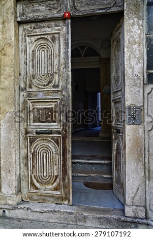 Istanbul, Turkey - A weathered partially opened doorway to an old apartment building in the Sultanahmet District, Old City, of Istanbul.