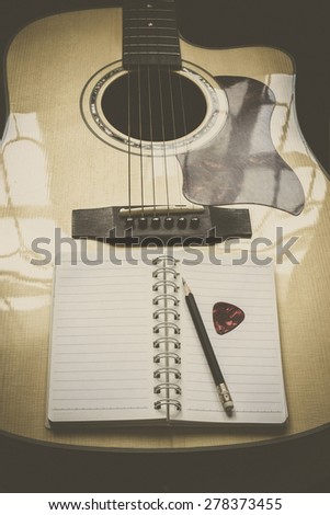 guitar,pencil and scrapbook ,Writing music in vintage tone