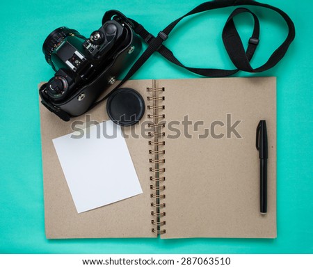 Still life-Journey concept,Scrapbook and SLR Film camera. White mock-up photo postcard