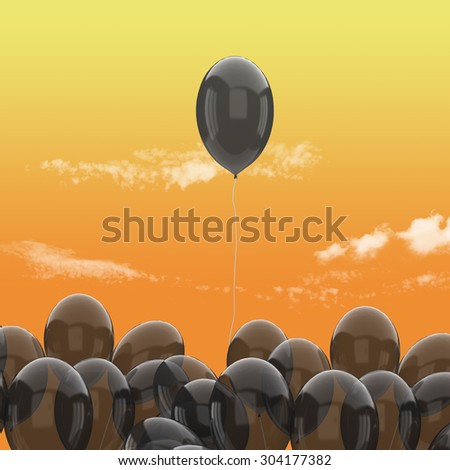 Halloween concept-The One of black balloon has been floating into orange sky background and cloudy