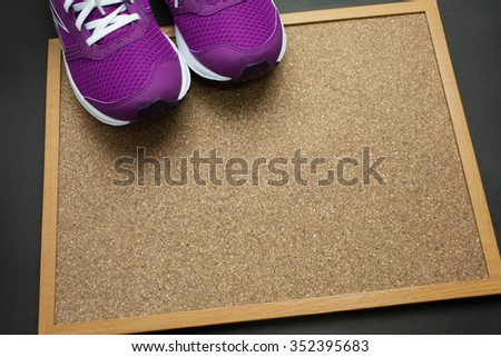 Purple Sneakers on Pin board with black background