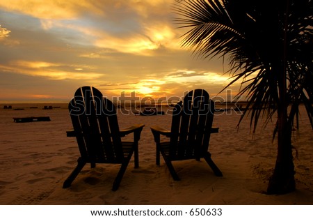 Adirondack Chairs On The Beach