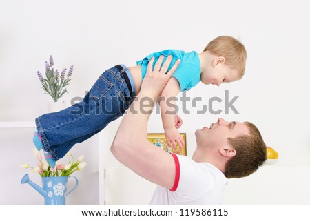Dad and son playing together at home