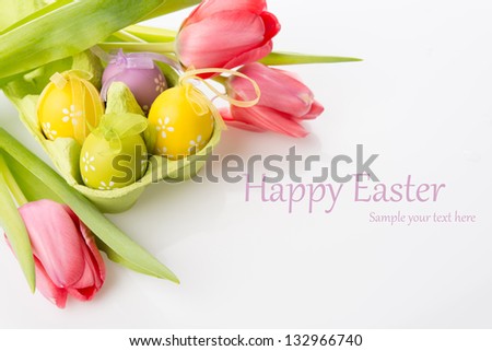 Easter eggs with tulips on white background Easter eggs with tulips on white background