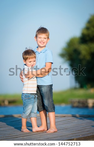 Portrait of two cute brothers walking in the outdoor