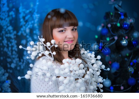 Snow Queen. Young woman with decorative ornament, looking at the camera close-up face