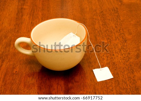 cup of black tea with tag .