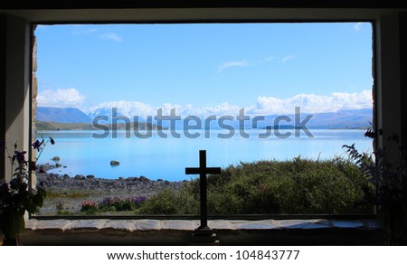 God\'s Window with stunning view of Lake Tekapo and Snow-Capped Mountains, captured in frame.