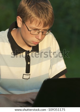 Teenager works at the computer