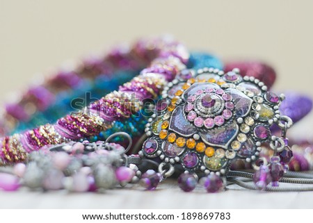 collection of assorted gemstone jewelery with stones, necklaces, rings, bracelets and chains