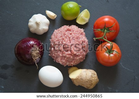 Raw Minced Meat With Vegetables For Homemade Meat Patty (Kabab, Kebab) On Black Chalkboard