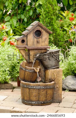 Bird House Water Fountain In Garden
