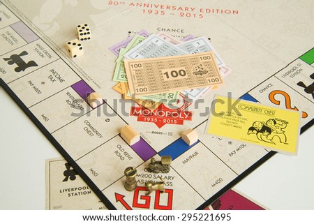 DUBAI, UAE - JULY 10, 2015: Monopoly Board Game Closeup. The classic real estate trading game from Parker Brothers was first introduced to America in 1935.