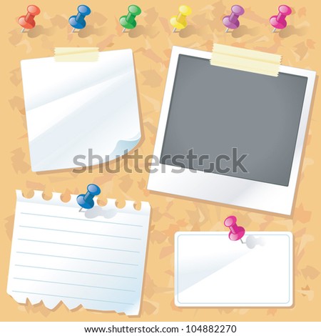 A cork notice board with a set of colorful pushpins papers a polaroid photo a business card and masking tape. A cork notice board with a set of colorful pushpins papers a polaroid photo a business card and masking tape.