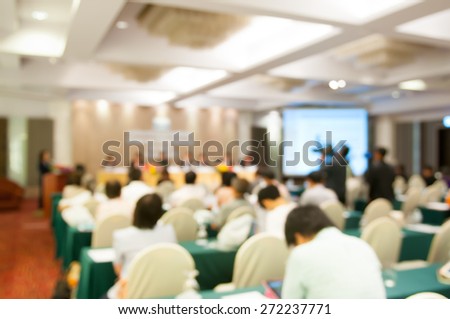 motion blur:de-focused Business Conference and Presentation. Audience at the conference hall.