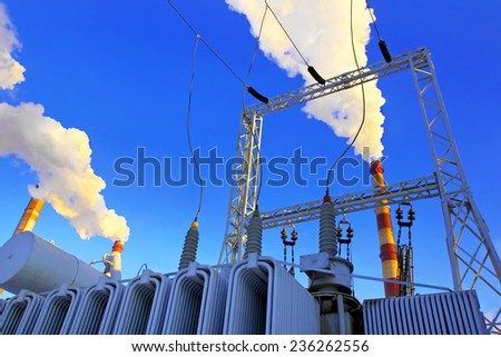 Industrial zone. The electric transformer against factory