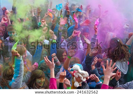 GATCHINA, LENINGRAD REGION, RUSSIA-29 September, 2013:The crowd of youth showers itself with paints in Gatchina, the Leningrad region, Russia,29 September,2013. Festival of paints Holi.