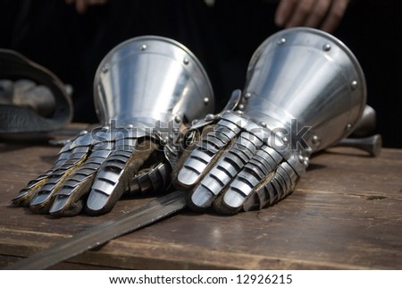 Knight Iron gloves on wooden table