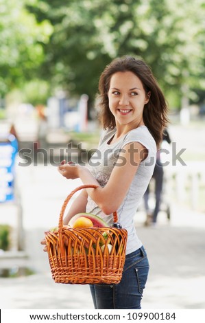The girl with the basket in the street