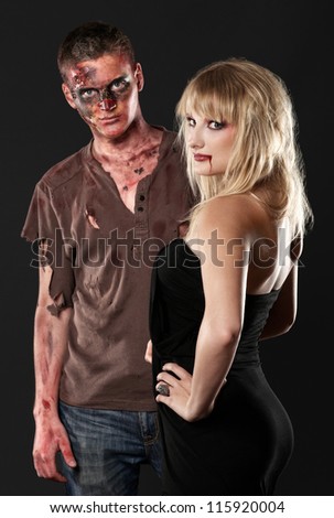 zombie and vampire  are standing in the dark studio