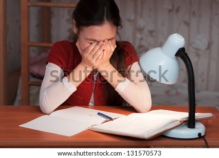 the girl was very tired to do homework