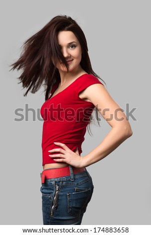 beautiful cheerful girl with fluttering hair isolated